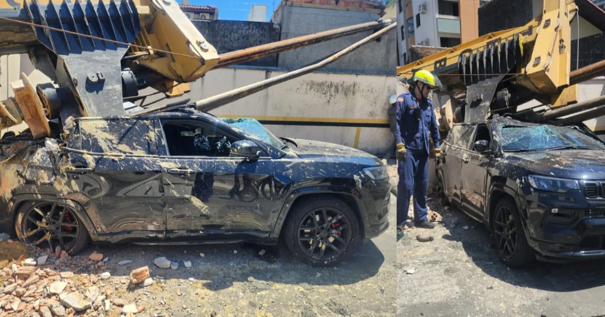 Terreno cede e máquina despenca sobre carro em rua movimentada de Florianópolis