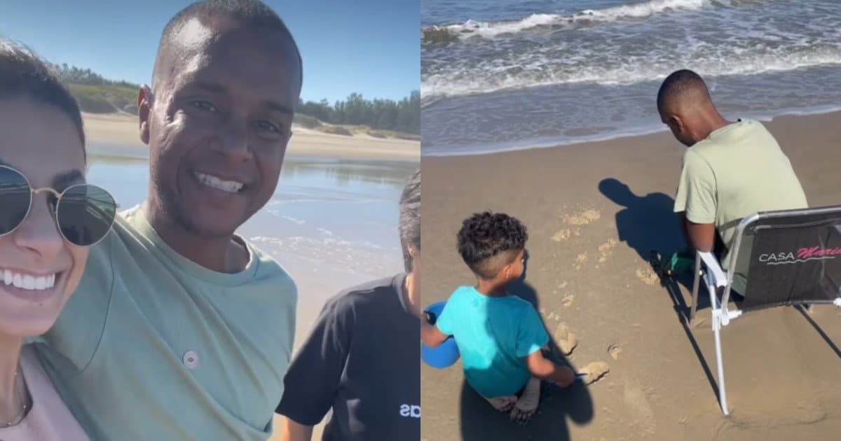 Soldado Anderson Gonçalves, o Dandinho, sorri ao lado da esposa e do filho na praia após alta hospitalar