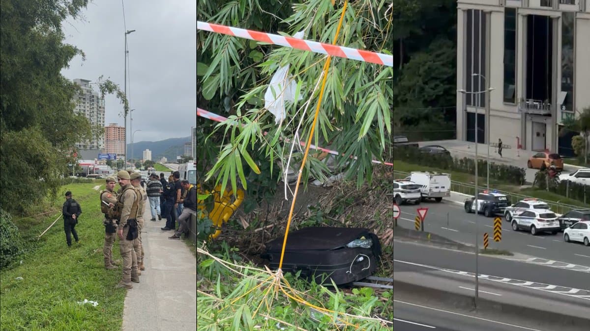 Policiais militares no local onde o corpo foi encontrado, mala com pertences do homem junto à vegetação e viaturas na marginal da BR-101 em Itapema