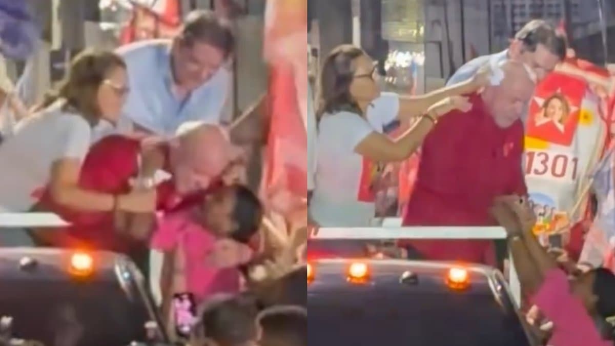 Janja retira os bracos de uma eleitora do pescoco de Lula em cima de uma caminhonete durante caminhada em Juazeiro do Norte
